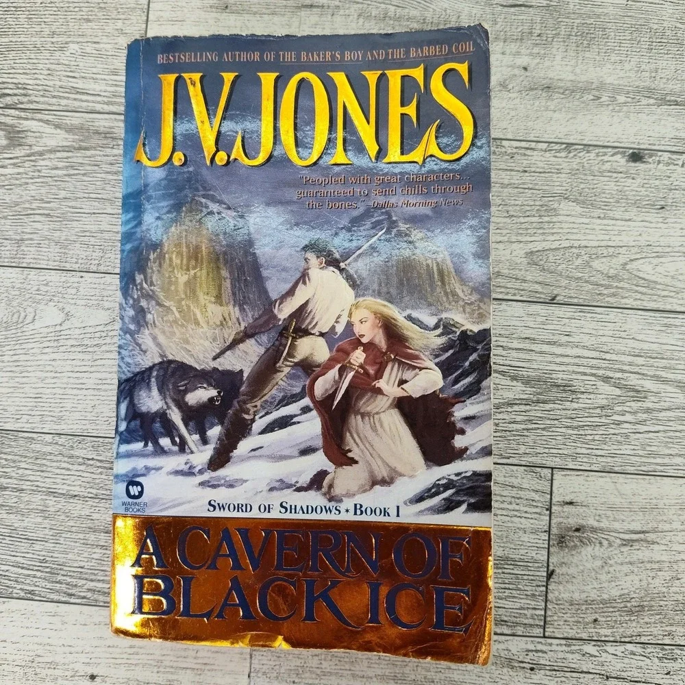 A CAVERN OF BLACK ICE JV Jones 2000 First US 11st Edition Warner Paperback‎